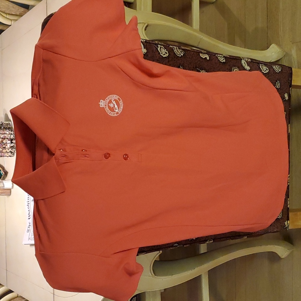 Brand new ladies golf polo shirt. Greg Norman Port Royal Golf Course Bermuda